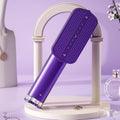 Défroisseur vapeur portable GoLiss violet compact et élégant, conçu pour le voyage